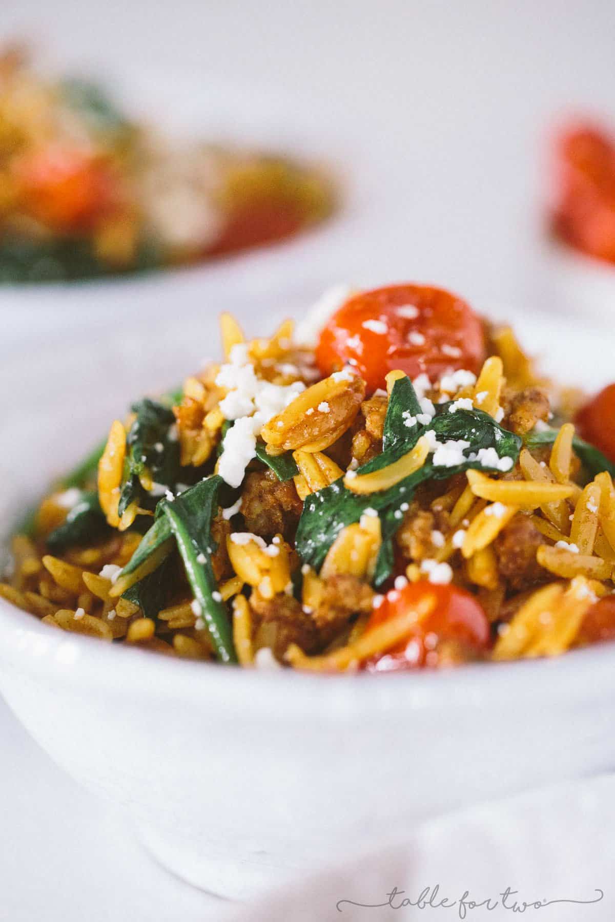 Cheesy chorizo orzo with blistered tomatoes and spinach is a quick and easy dinner with simple ingredients! Small ingredient list, LARGE flavor! You will love the flavors of this and how little effort it takes to come together!
