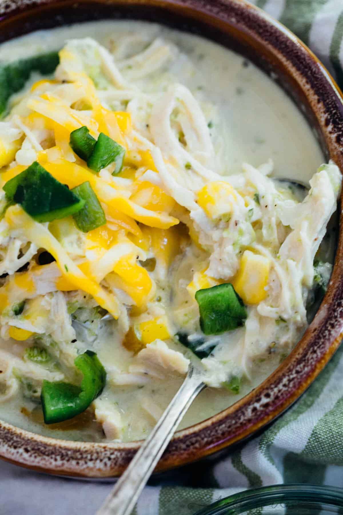 This creamy poblano pepper and chicken soup has all your favorite components in a delicious soup! A subtle hint of spiciness along with the smokey charred poblanos and the creaminess of the soup rounds it all out. I promise this will be a new favorite!