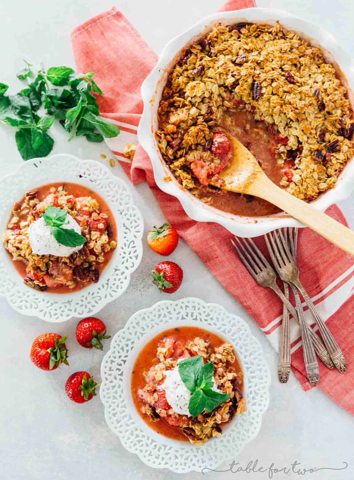 A quick and easy way to use up all your fresh mint from the garden and the fresh strawberries of the season! Strawberry mint crisp is an easy dessert with the most flavorful crisp topping! Don't forget the ice cream scoop on top!