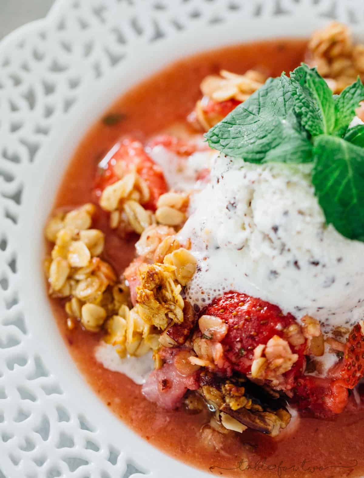 A quick and easy way to use up all your fresh mint from the garden and the fresh strawberries of the season! Strawberry mint crisp is an easy dessert with the most flavorful crisp topping! Don't forget the ice cream scoop on top!