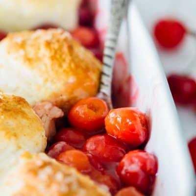It could not be easier to make a classic sour cherry cobbler right in your own home. Using the seasonal and fresh cherries, this classic sour cherry cobbler comes together quickly and easily! Use any seasonal fruit in this recipe and top with a giant scoop of ice cream for the ultimate dessert!
