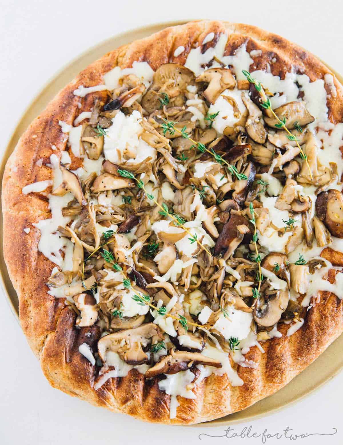 Mushroom lovers will be in paradise with this triple mushroom and herb grilled pizza! The earthy and hearty mushrooms on top of this pizza pair perfectly with the creamy ricotta and mozzarella cheese!