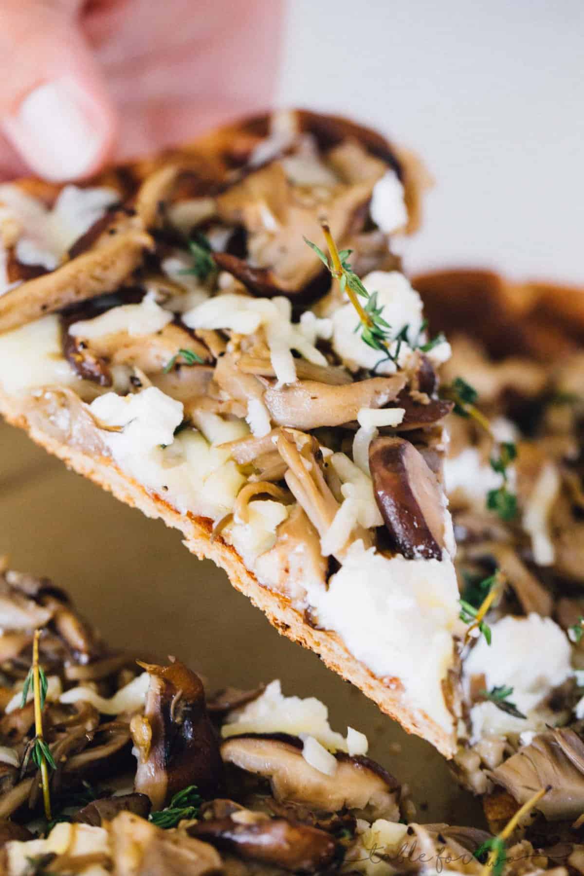 Mushroom lovers will be in paradise with this triple mushroom and herb grilled pizza! The earthy and hearty mushrooms on top of this pizza pair perfectly with the creamy ricotta and mozzarella cheese!