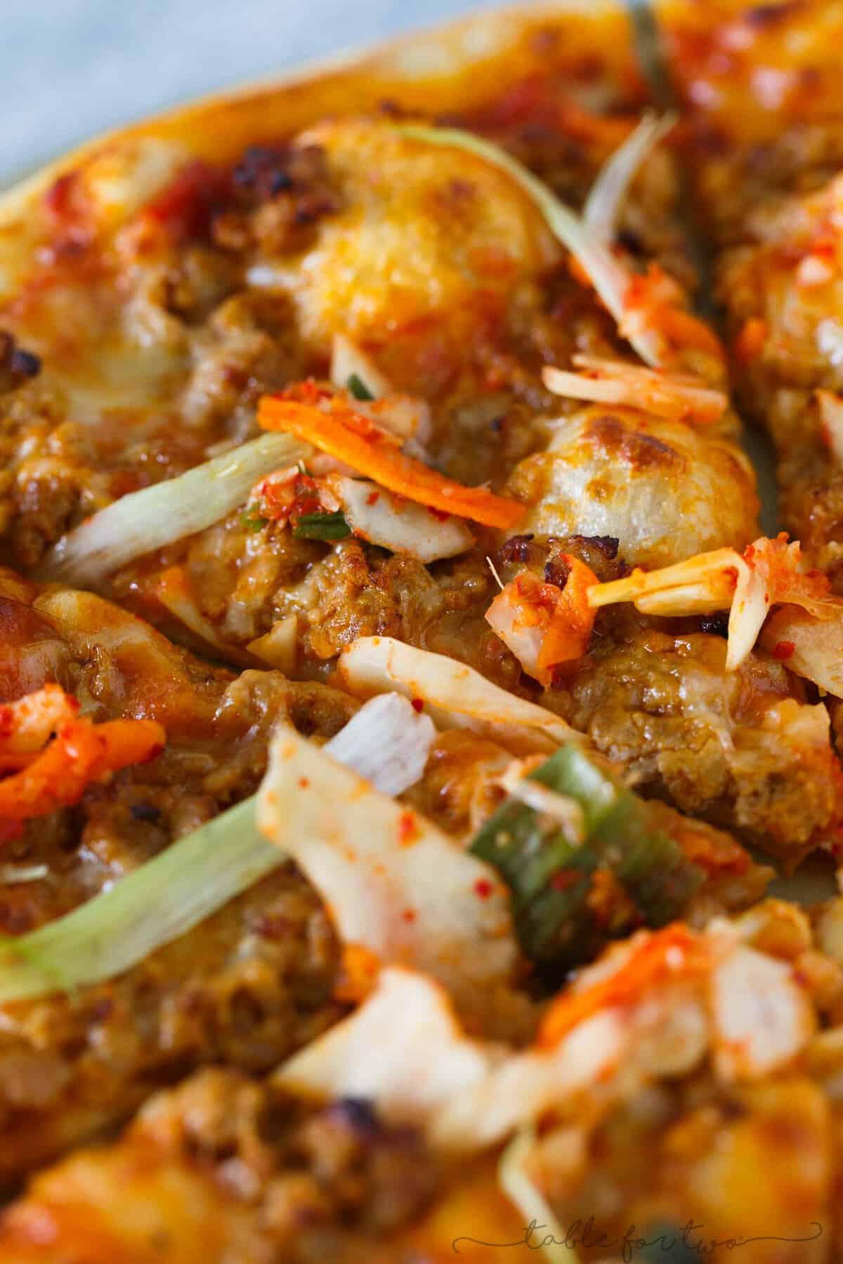 Italy meets Korea in this unique spicy Korean pork pizza recipe! This is a completely fun new way to make and eat pizza if you are a fan of Korean and Asian flavors! The flavors are so bold and perfectly balanced!