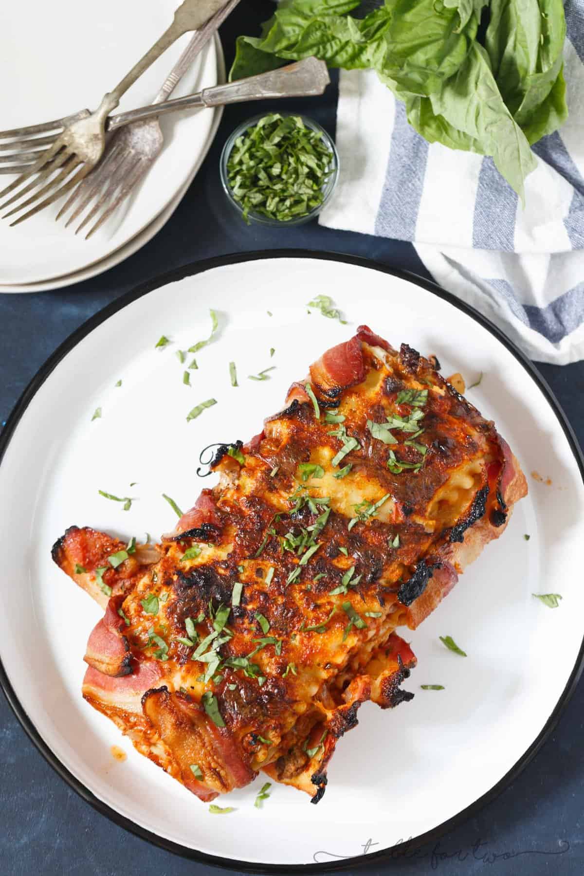 Who could say no to bacon wrapped lasagna? Once you have a bite of this, you will won't want to make lasagna any other way! This is such an awesome, decadent spin on the classic and traditional lasagna!