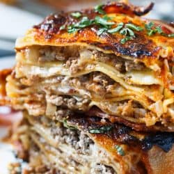 Who could say no to bacon wrapped lasagna? Once you have a bite of this, you will won't want to make lasagna any other way! This is such an awesome, decadent spin on the classic and traditional lasagna!