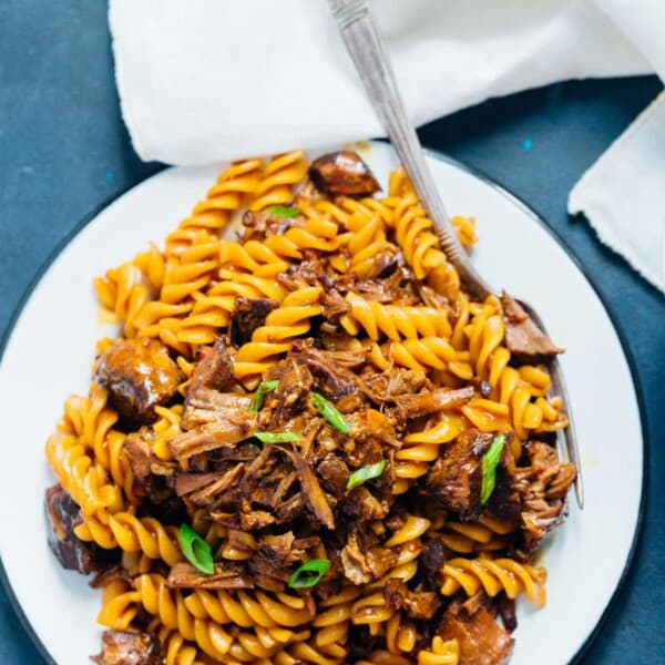 This pressure cooker (Instant Pot) braised Korean beef ragu has got spice, depth of flavor, and so much goodness. Best part? Pressure cooker friendly which means super tender and fall apart beef in about 40 minutes! This is the stick to your ribs dish you'll want when you are in the mood for a rich and dense dish!