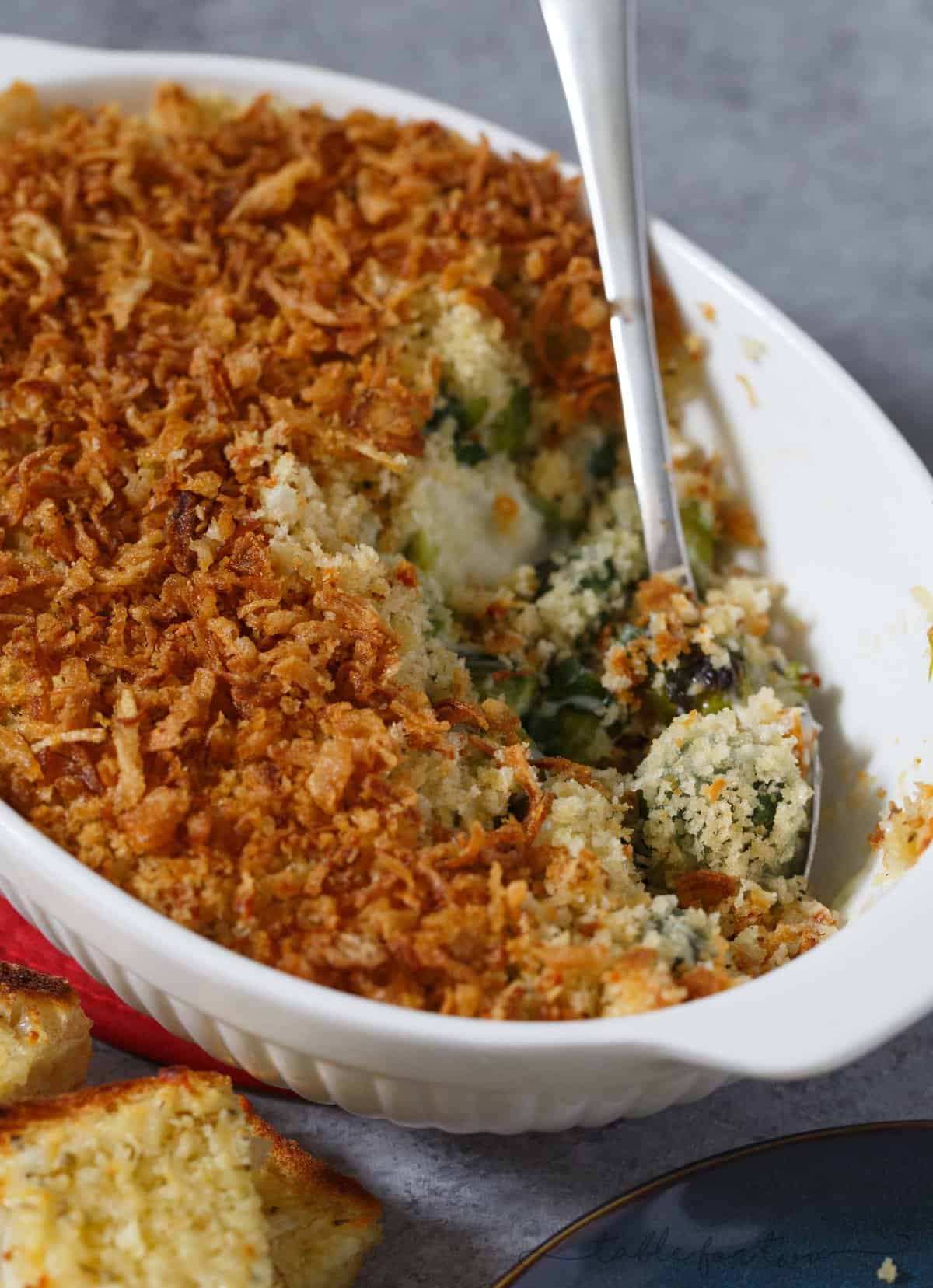 Pretty sure if you hate brussels sprouts, you haven't had them the right way. This roasted brussels sprouts gratin with garlic crumble and fried onion topping is going to elevate your side dish game at any party or potluck AND you will fall in love with brussels sprouts all over again! PROMISE!