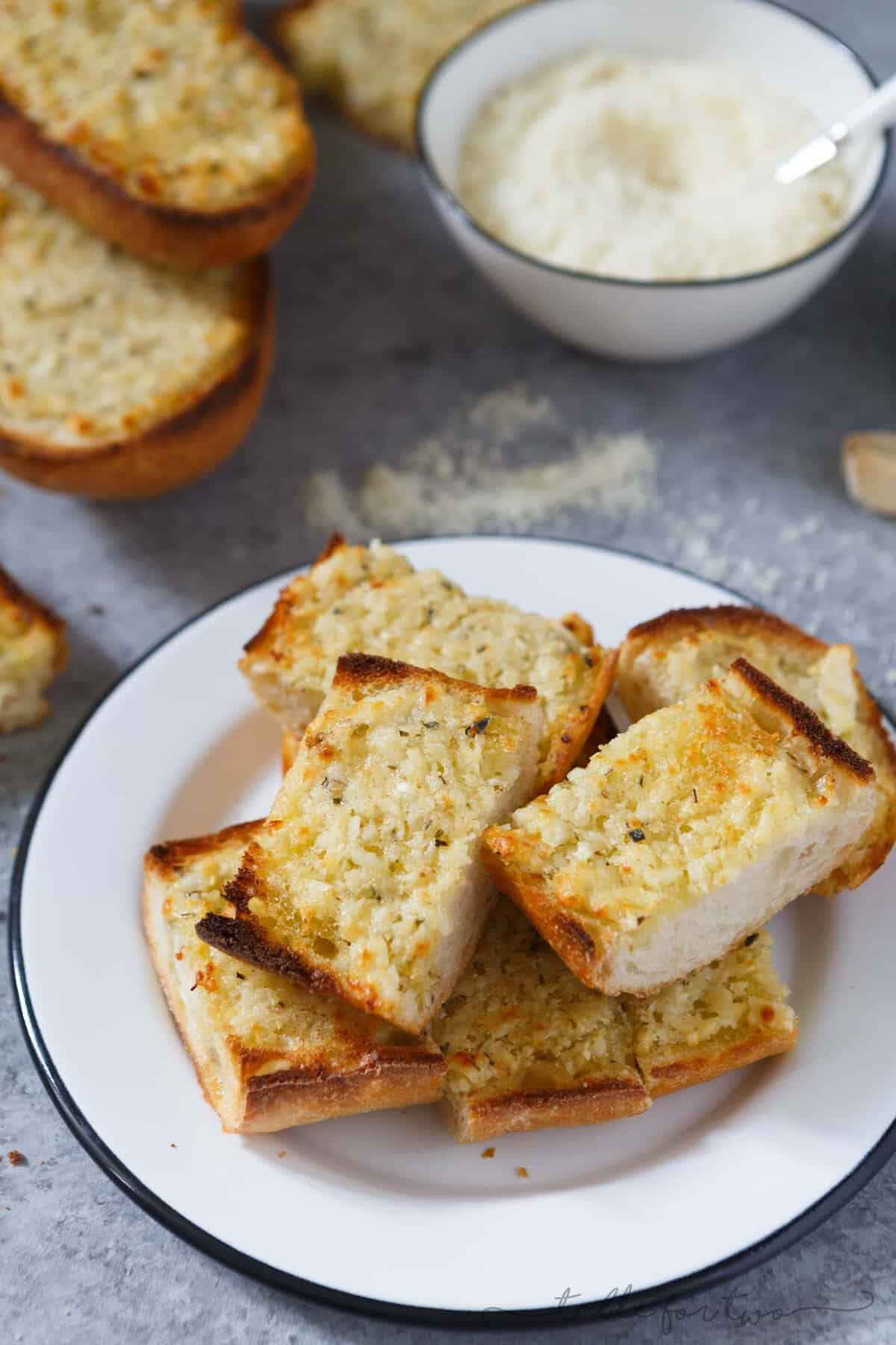 The title of this recipe says it all. Kiss me if you dare because after noshing on this extra garlicky and cheesy bread, you're probably going to second guess it. However, eating this bread is 100% worth the garlicky breath.