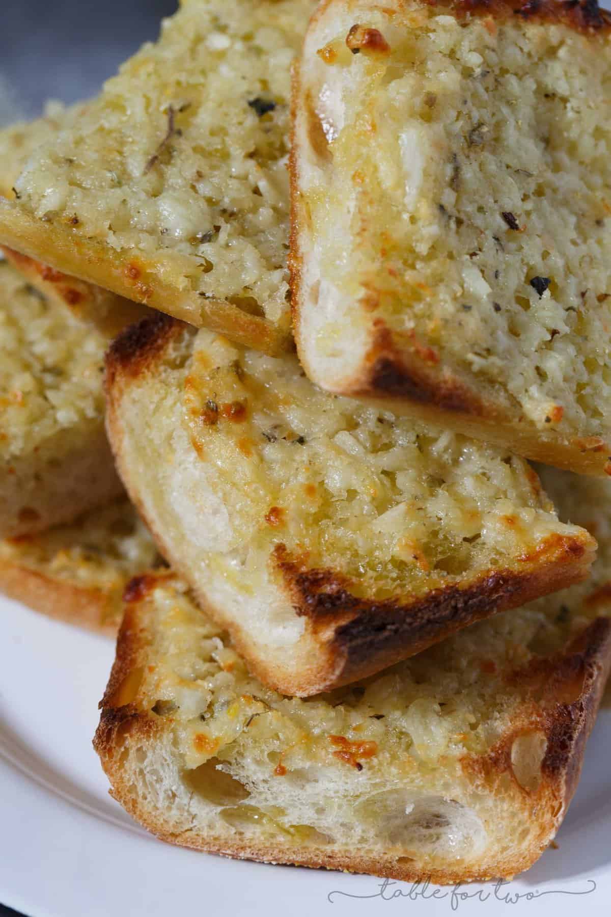 The title of this recipe says it all. Kiss me if you dare because after noshing on this extra garlicky and cheesy bread, you're probably going to second guess it. However, eating this bread is 100% worth the garlicky breath.