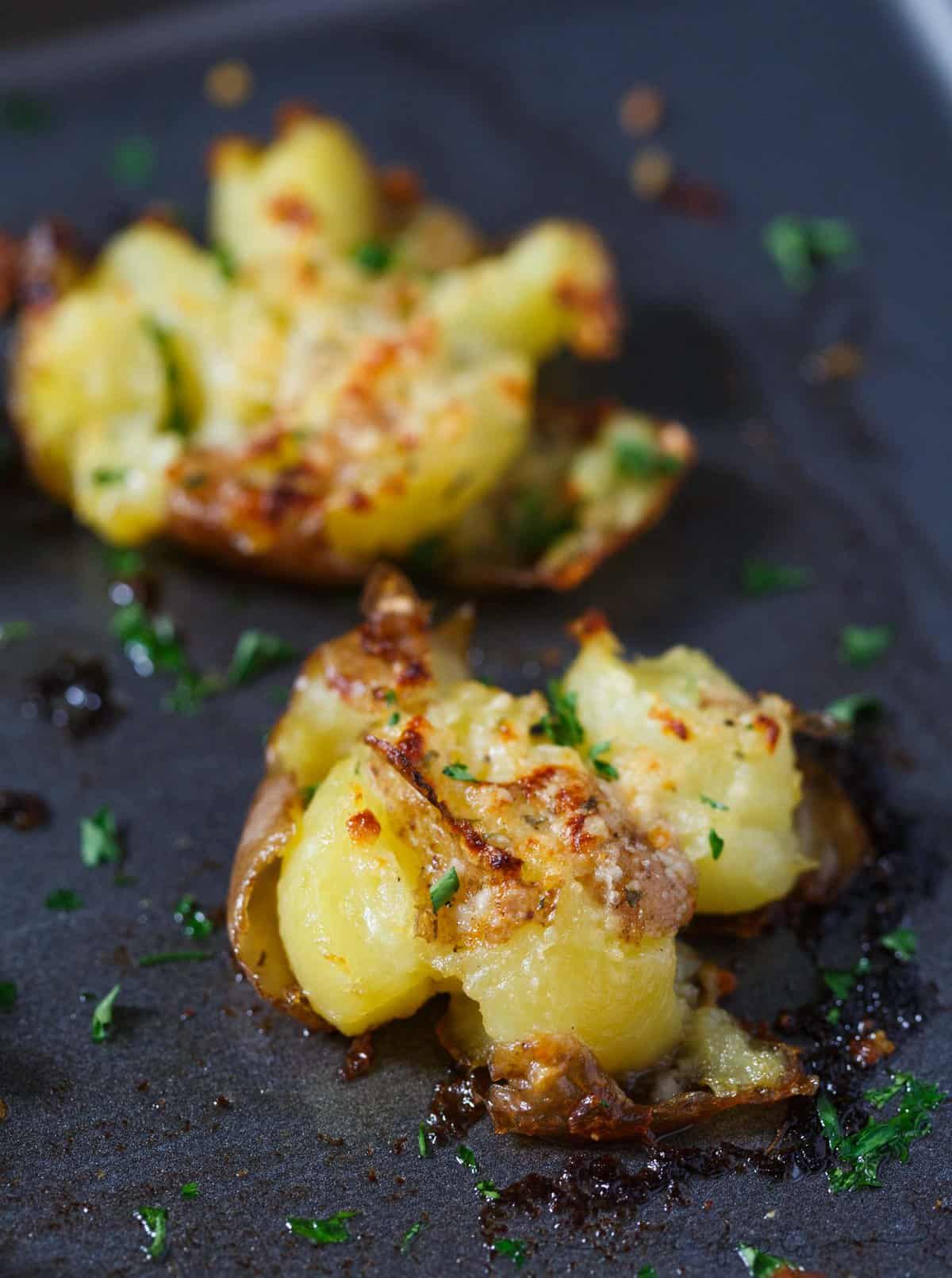 Smashed potatoes are a great alternative to mashed potatoes! These smashed potatoes are topped with a garlic ranch butter then parmesan cheese is sprinkled on top! SO GOOD!!