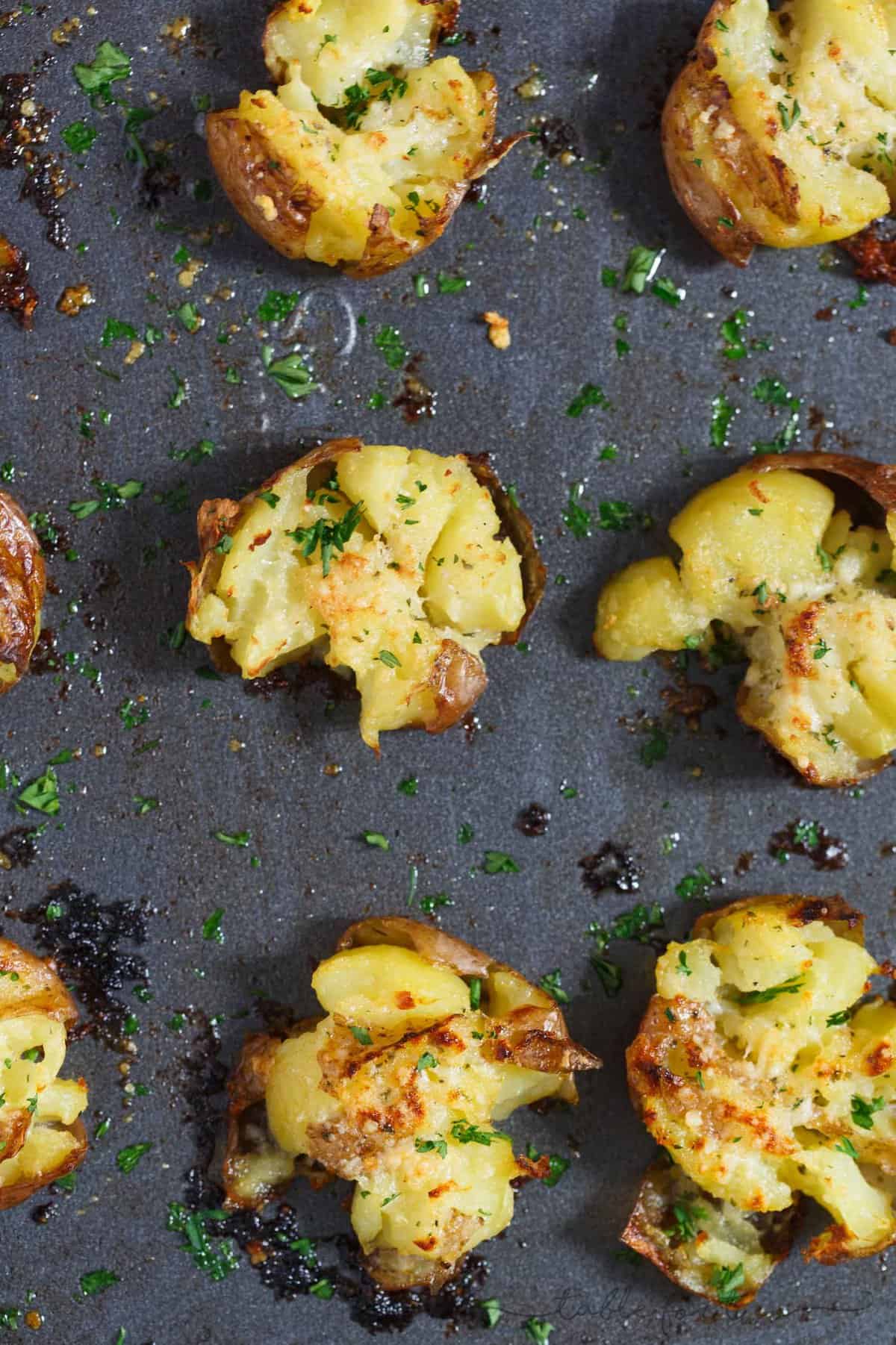 Smashed potatoes are a great alternative to mashed potatoes! These smashed potatoes are topped with a garlic ranch butter then parmesan cheese is sprinkled on top! SO GOOD!!