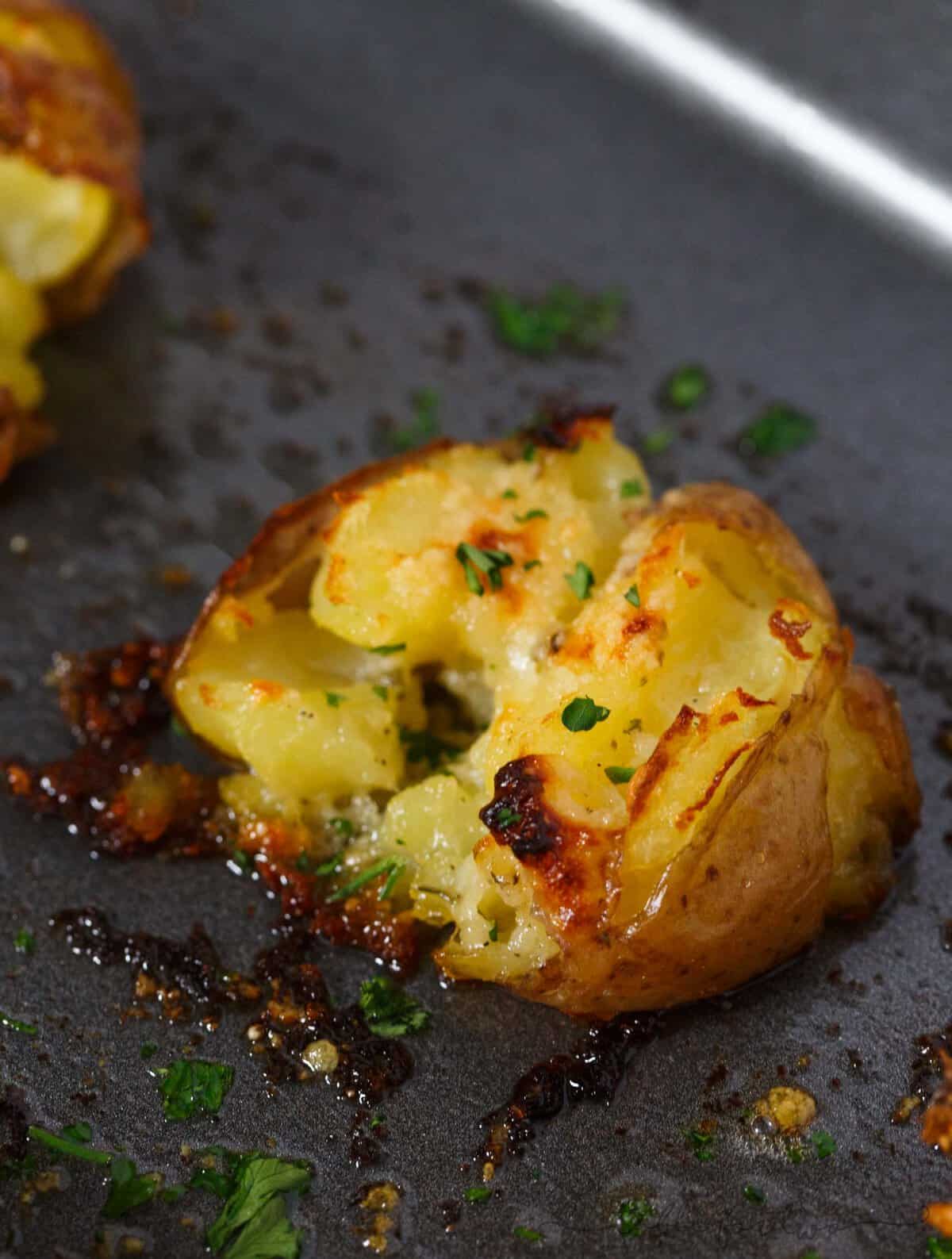 Smashed potatoes are a great alternative to mashed potatoes! These smashed potatoes are topped with a garlic ranch butter then parmesan cheese is sprinkled on top! SO GOOD!!