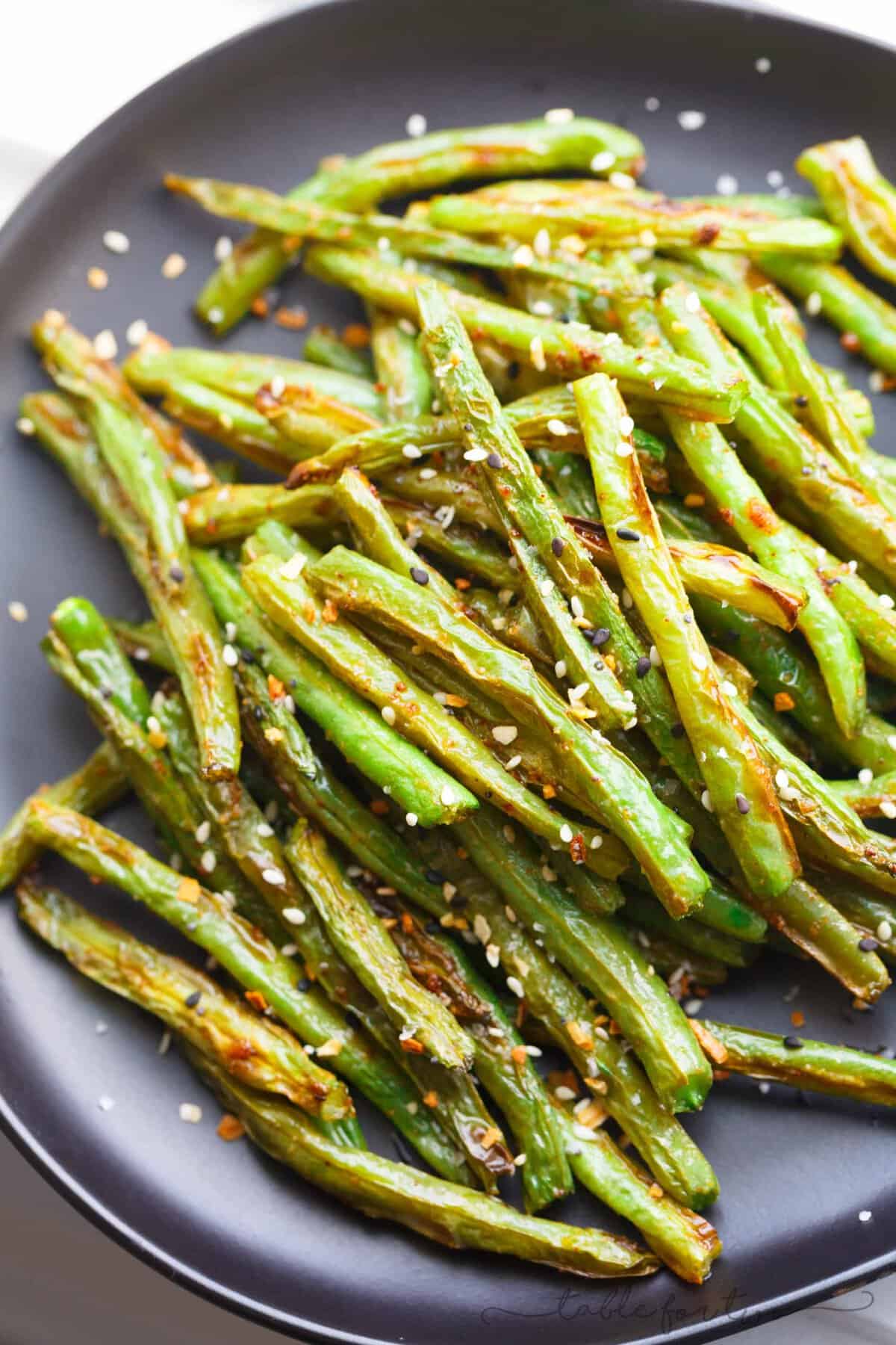 These garlic roasted green beans are the perfect side dish addition to any table and meal! They will convert you to love green beans if you don't already!