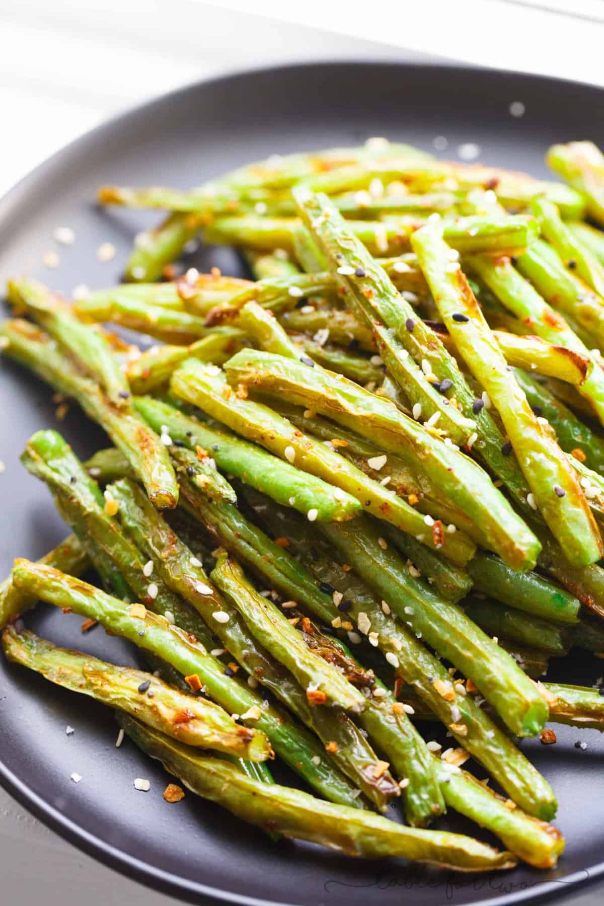 These garlic roasted green beans are the perfect side dish addition to any table and meal! They will convert you to love green beans if you don't already!