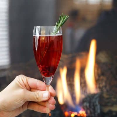 Pomegranate prosecco punch is a beautiful drink that is full of flavor! Tangy, sweet, and bubbly — everything you want in a cocktail!