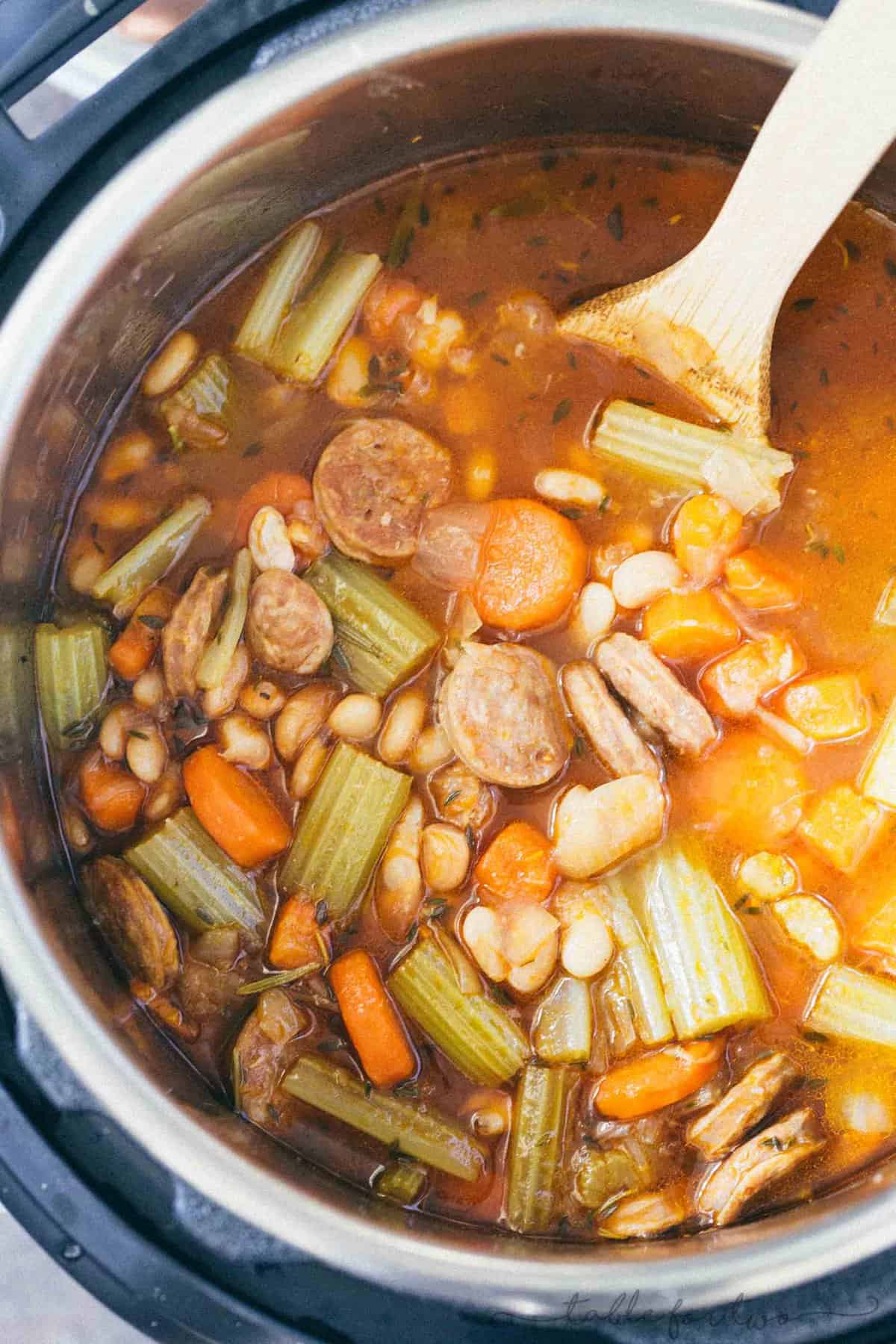 A deliciously flavorful herbed white bean and sausage soup that requires no beans to be soaked! This will be a new Instant Pot favorite!