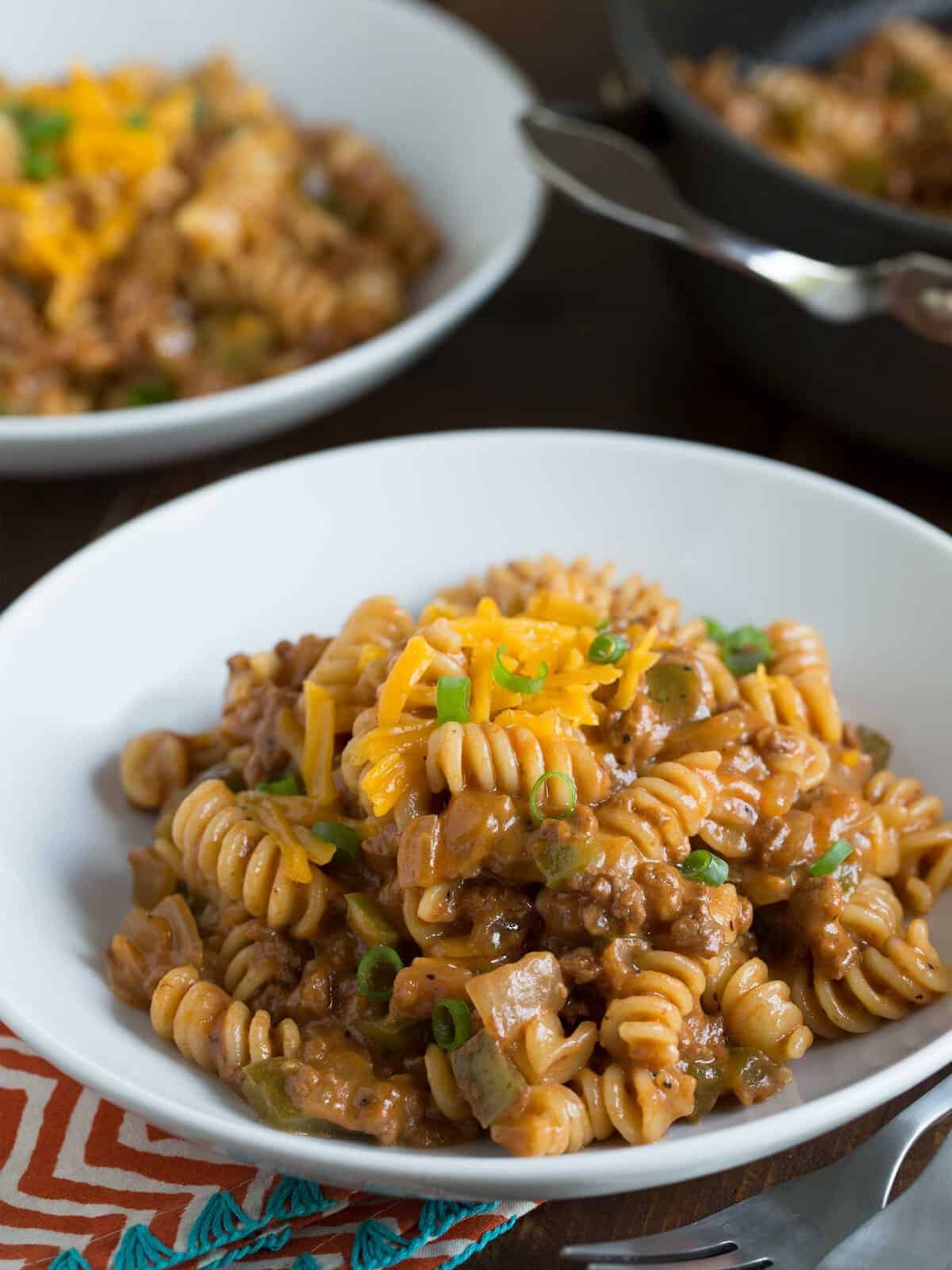 Sloppy Joe mac 'n cheese is going to be your family's new favorite weeknight meal! It's so easy to put together and packed with LOTS of flavor! It's just like the traditional sandwich but FAR better and less messy to eat!