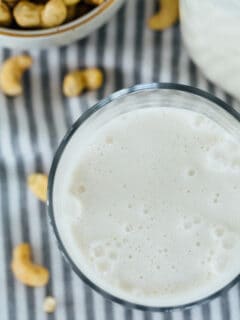 Making your own cashew milk at home is super easy and it seriously tastes so much cleaner and better than the store-bought kind. You know exactly what goes into it — cashews and water — and you can add additional flavors if you desire! #homemadecashewmilk #cashewmilk #cashewbeverage #homemade