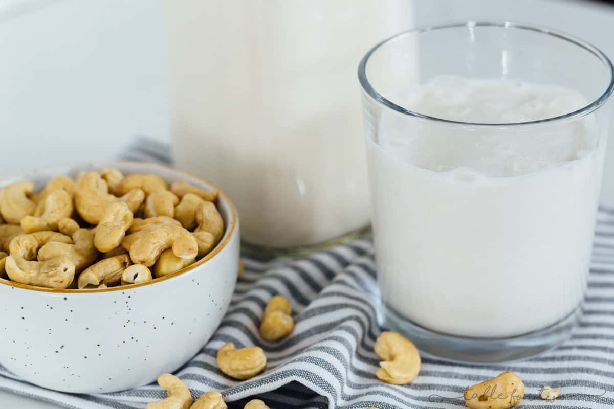 Making your own cashew milk at home is super easy and it seriously tastes so much cleaner and better than the store-bought kind. You know exactly what goes into it — cashews and water — and you can add additional flavors if you desire! #homemadecashewmilk #cashewmilk #cashewbeverage #homemade