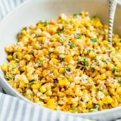 A less messy way to eat Mexican street corn! This Mexican street corn off the cob is one you'll want to make for all your parties year-round! #mexicanstreetcorn #corn #mexican #sidedish #cornrecipe