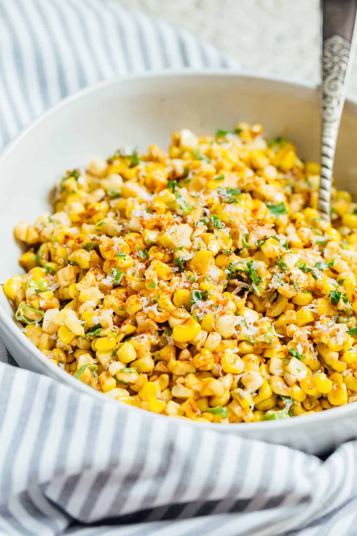 A less messy way to eat Mexican street corn! This Mexican street corn off the cob is one you'll want to make for all your parties year-round!