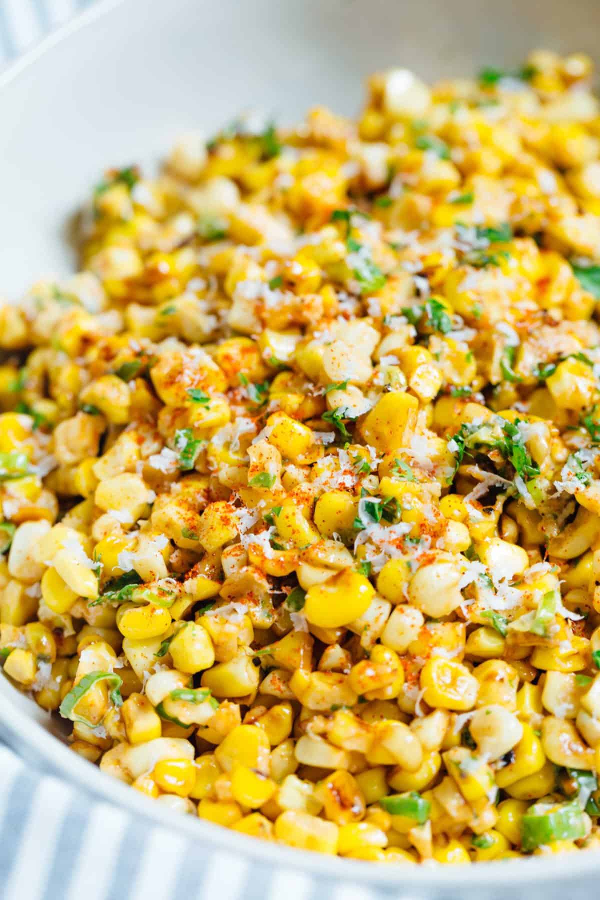 A less messy way to eat Mexican street corn! This Mexican street corn off the cob is one you'll want to make for all your parties year-round! #mexicanstreetcorn #corn #mexican #sidedish #cornrecipe