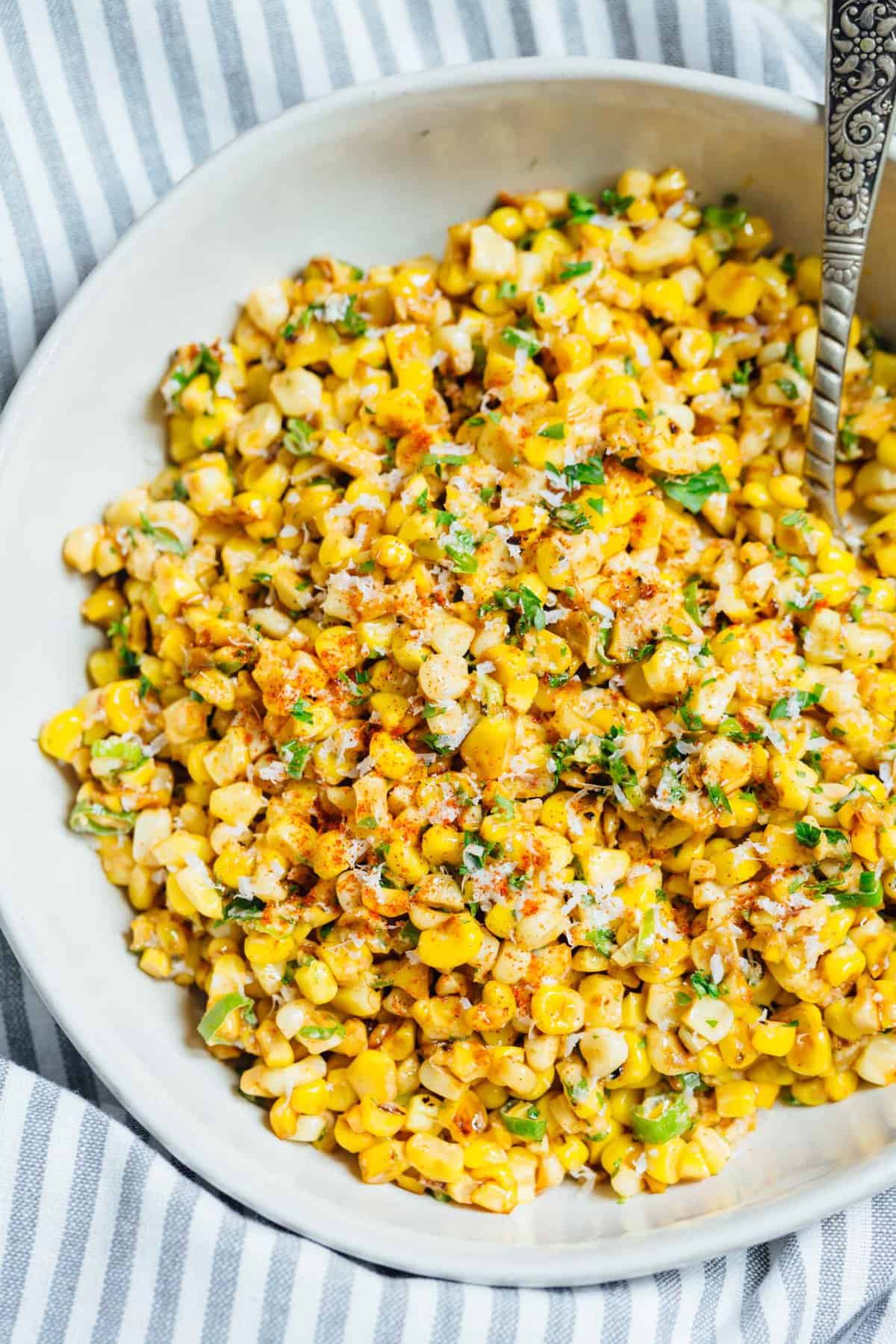 A less messy way to eat Mexican street corn! This Mexican street corn off the cob is one you'll want to make for all your parties year-round! #mexicanstreetcorn #corn #mexican #sidedish #cornrecipe