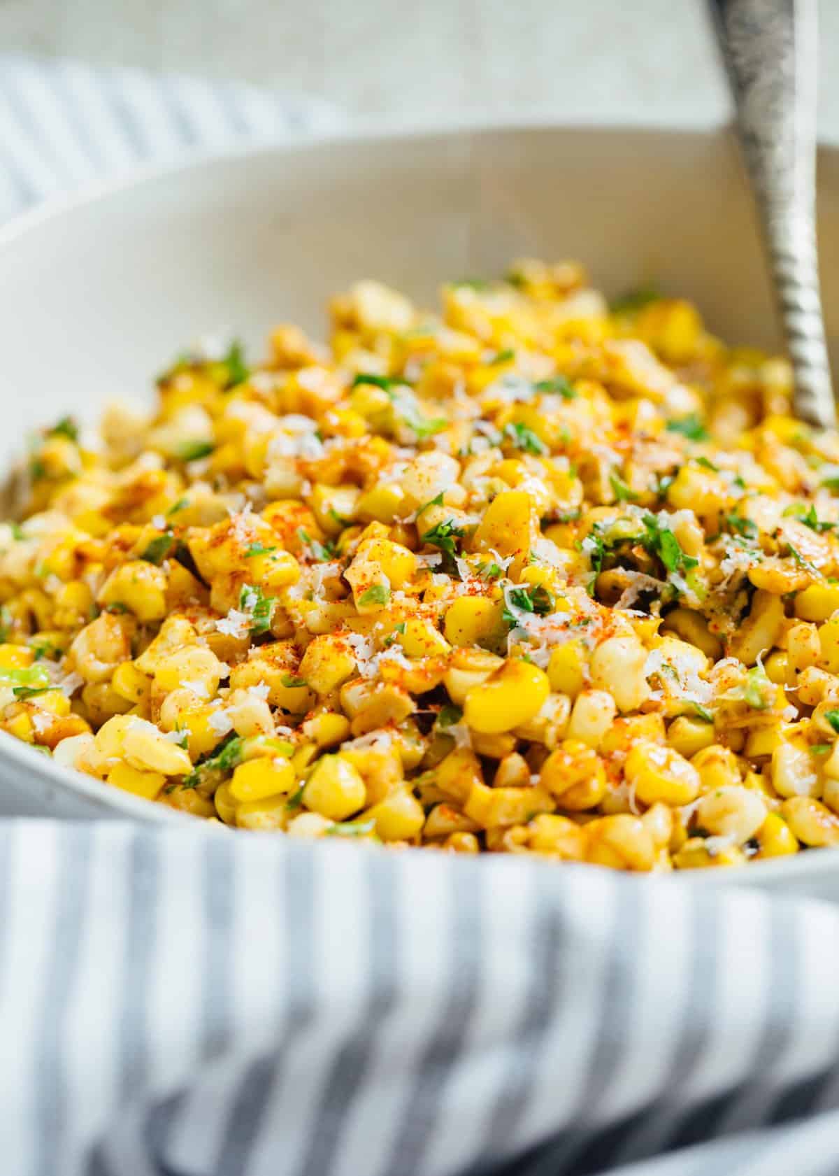 A less messy way to eat Mexican street corn! This Mexican street corn off the cob is one you'll want to make for all your parties year-round! #mexicanstreetcorn #corn #mexican #sidedish #cornrecipe