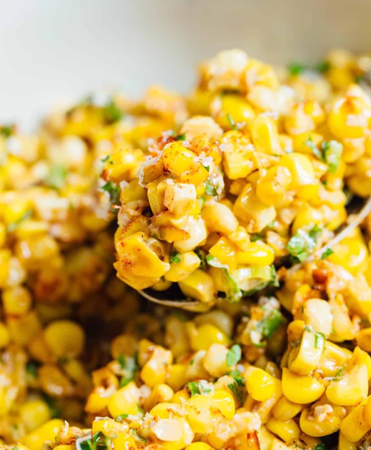 A less messy way to eat Mexican street corn! This Mexican street corn off the cob is one you'll want to make for all your parties year-round! #mexicanstreetcorn #corn #mexican #sidedish #cornrecipe