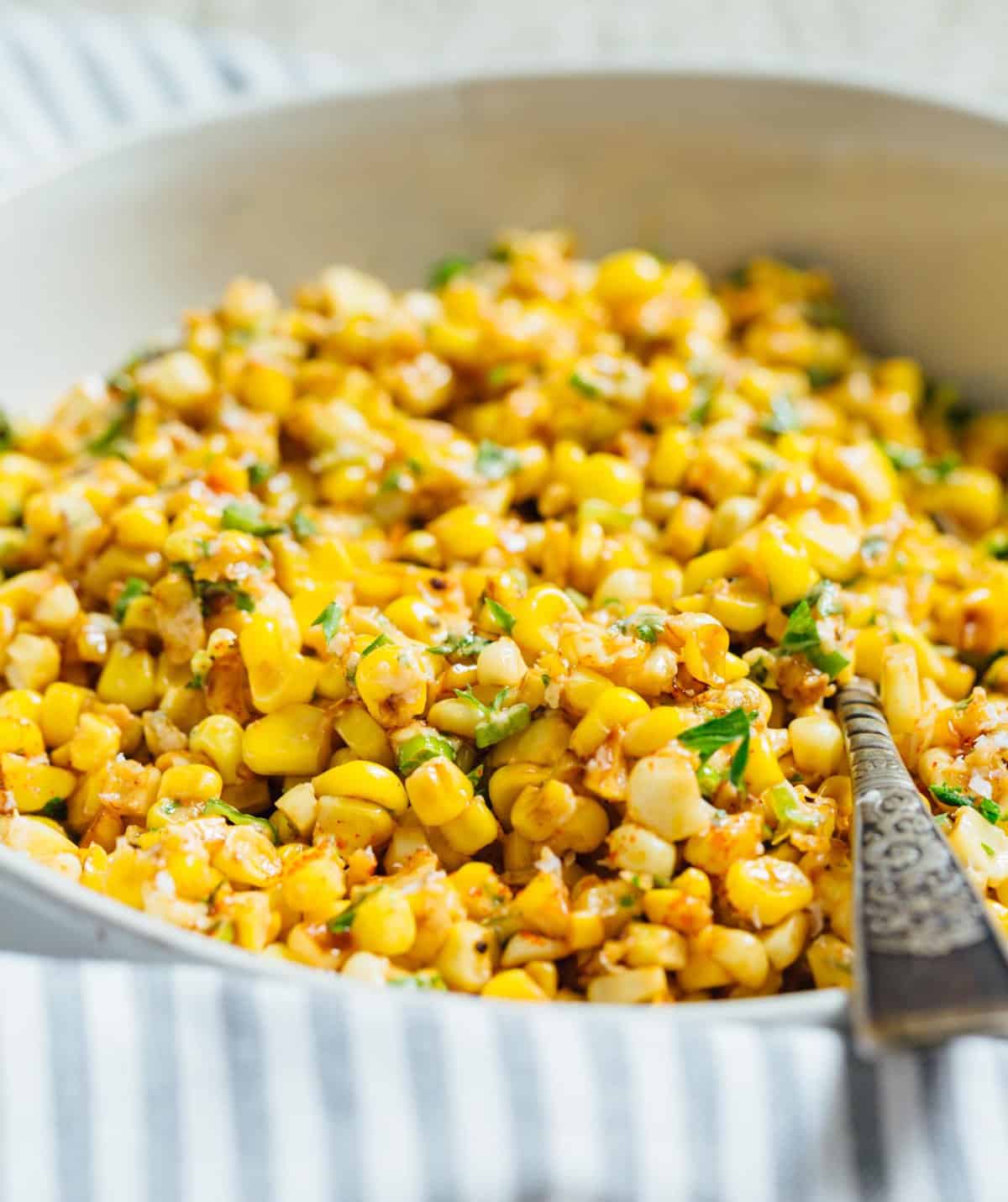 A less messy way to eat Mexican street corn! This Mexican street corn off the cob is one you'll want to make for all your parties year-round! #mexicanstreetcorn #corn #mexican #sidedish #cornrecipe