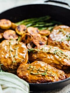 Apricot balsamic pork chops are going to be in your weeknight dinner rotation after your first bite of this sweet and tangy dish! #apricotbalsamic #apricot #porkchops #quickdinner #easydinner #skilletdinner
