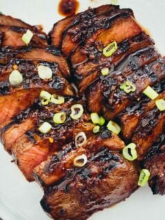This grilled Asian marinated flat iron steak is a quick weeknight meal when you're looking to change up traditional grilled steak! #grilling #steak #flatironsteak #asianmarinade