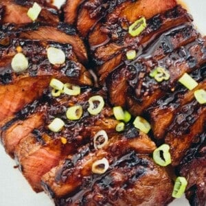 This grilled Asian marinated flat iron steak is a quick weeknight meal when you're looking to change up traditional grilled steak! #grilling #steak #flatironsteak #asianmarinade