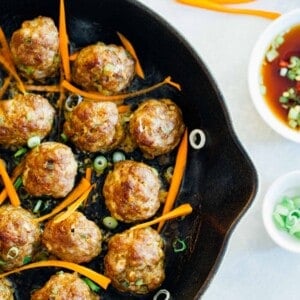 These Asian pork meatballs have a lot of flavor and are perfect topped on rice noodles or a bowl of rice! They are great for party appetizers too! #porkmeatballs #asianmeatballs #meatballrecipe