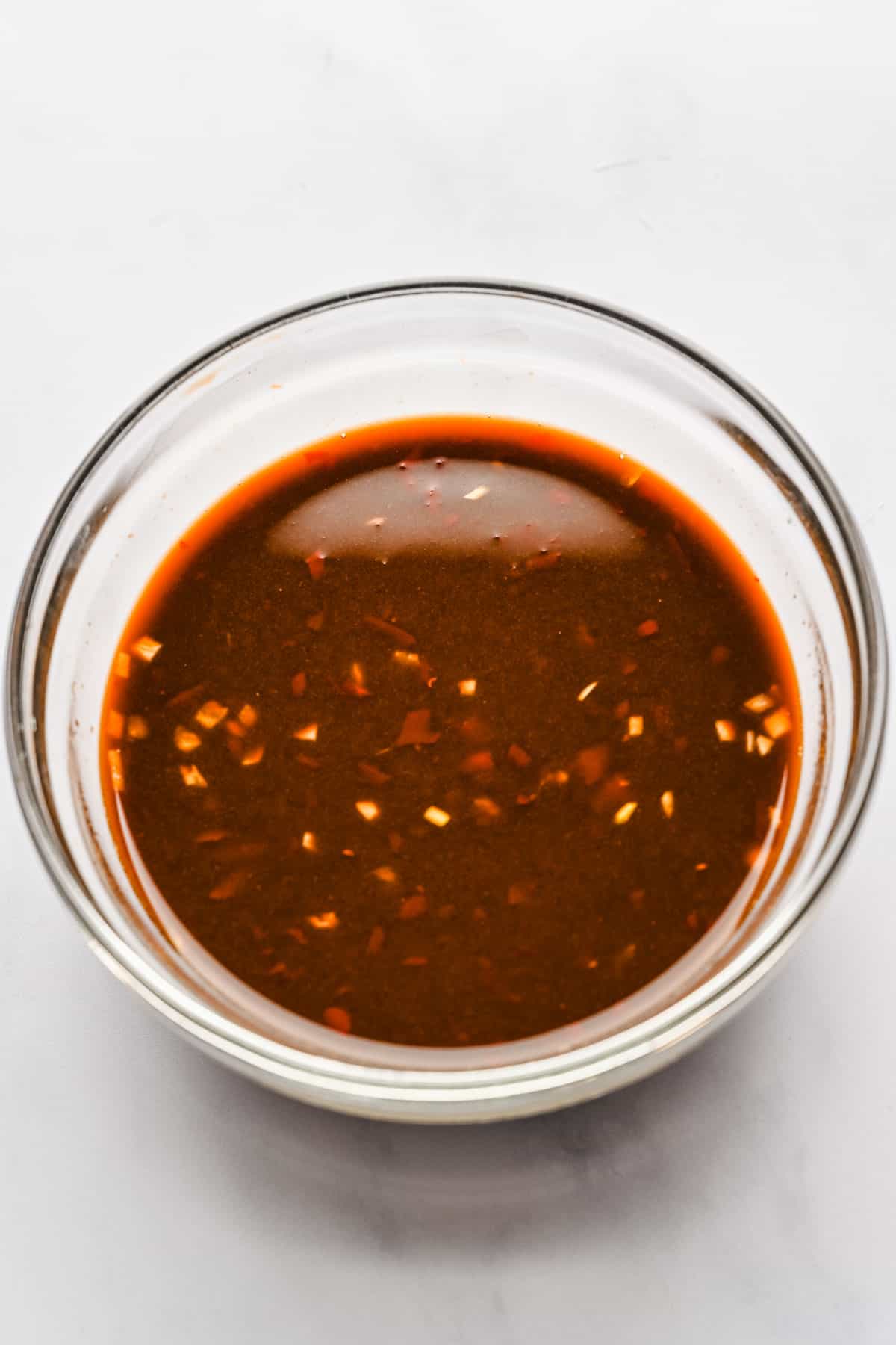 Sesame garlic sauce in a glass bowl.