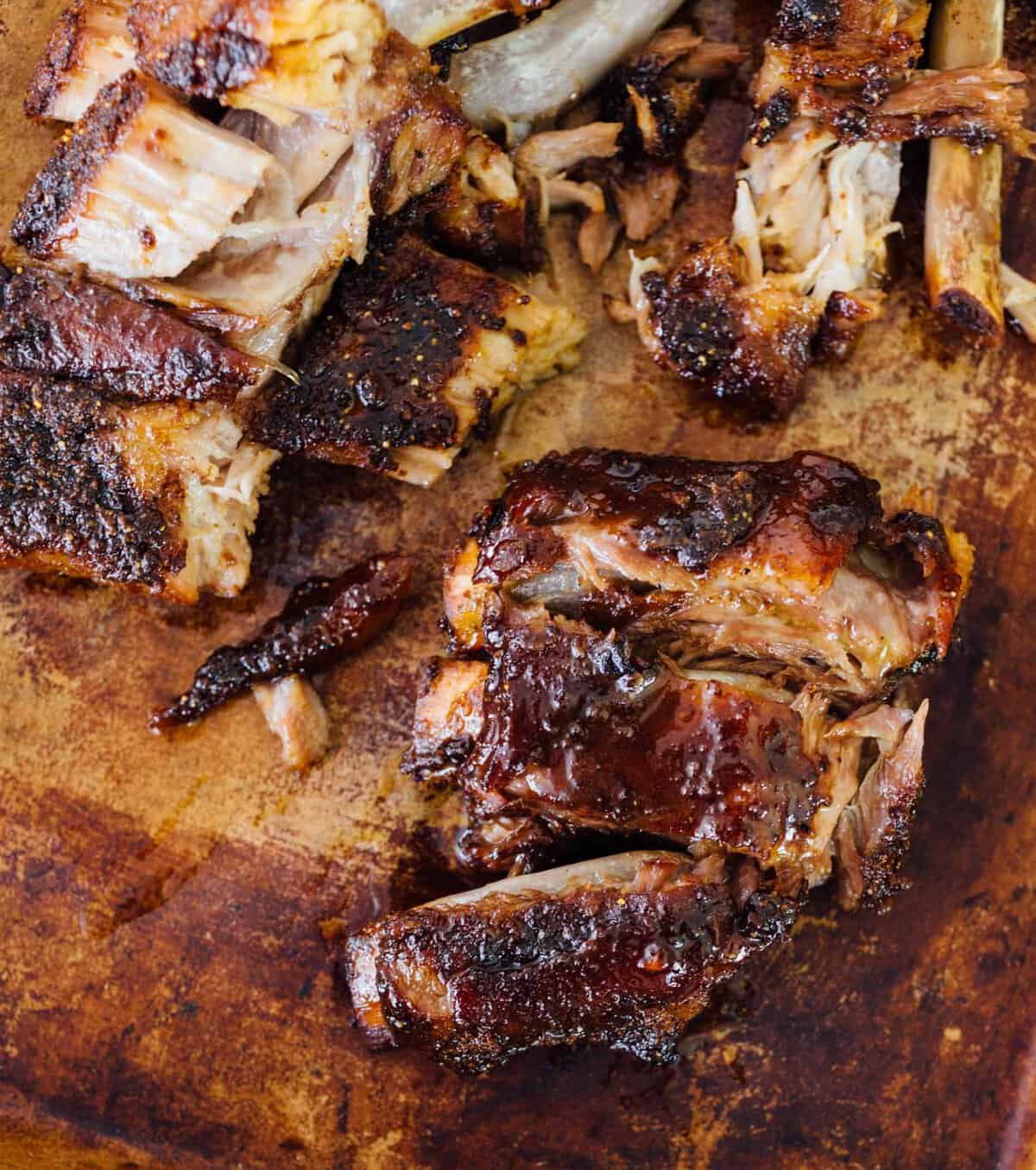 These tender honey butter ribs are oven baked to perfection and they fall off the bone! They are literally bathed in honey, butter, and brown sugar. There is no way you will be able to put this down! #honey #butter #ribs #babybackribs #ovenbaked #pork #porkrecipe