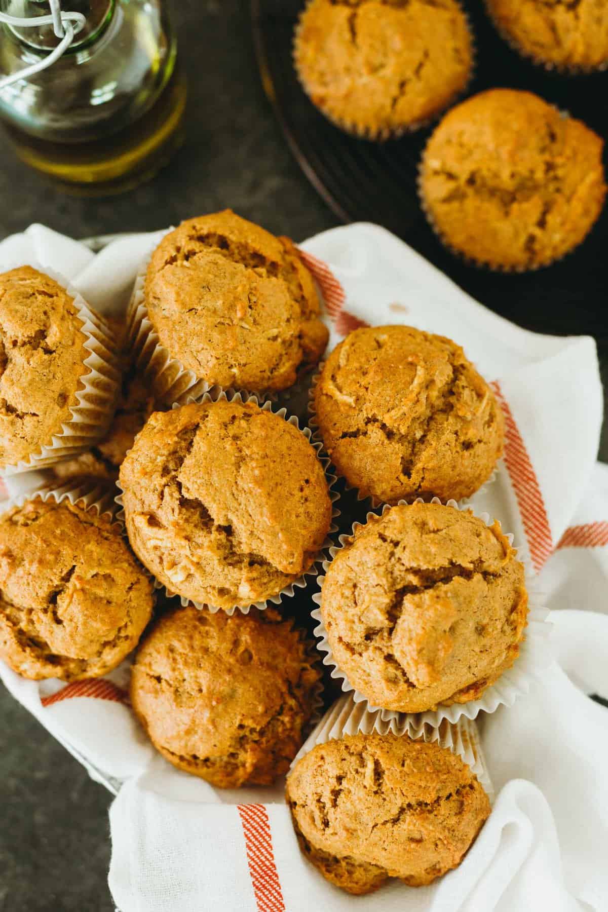 Soft and tender pumpkin apple olive oil muffins are the perfect muffins to make for Fall! The robust olive oil with the fresh apples make for a delicious flavor combination! #pumpkinrecipes #applerecipes #pumpkinapple #pumpkin #muffinrecipe #fallflavor