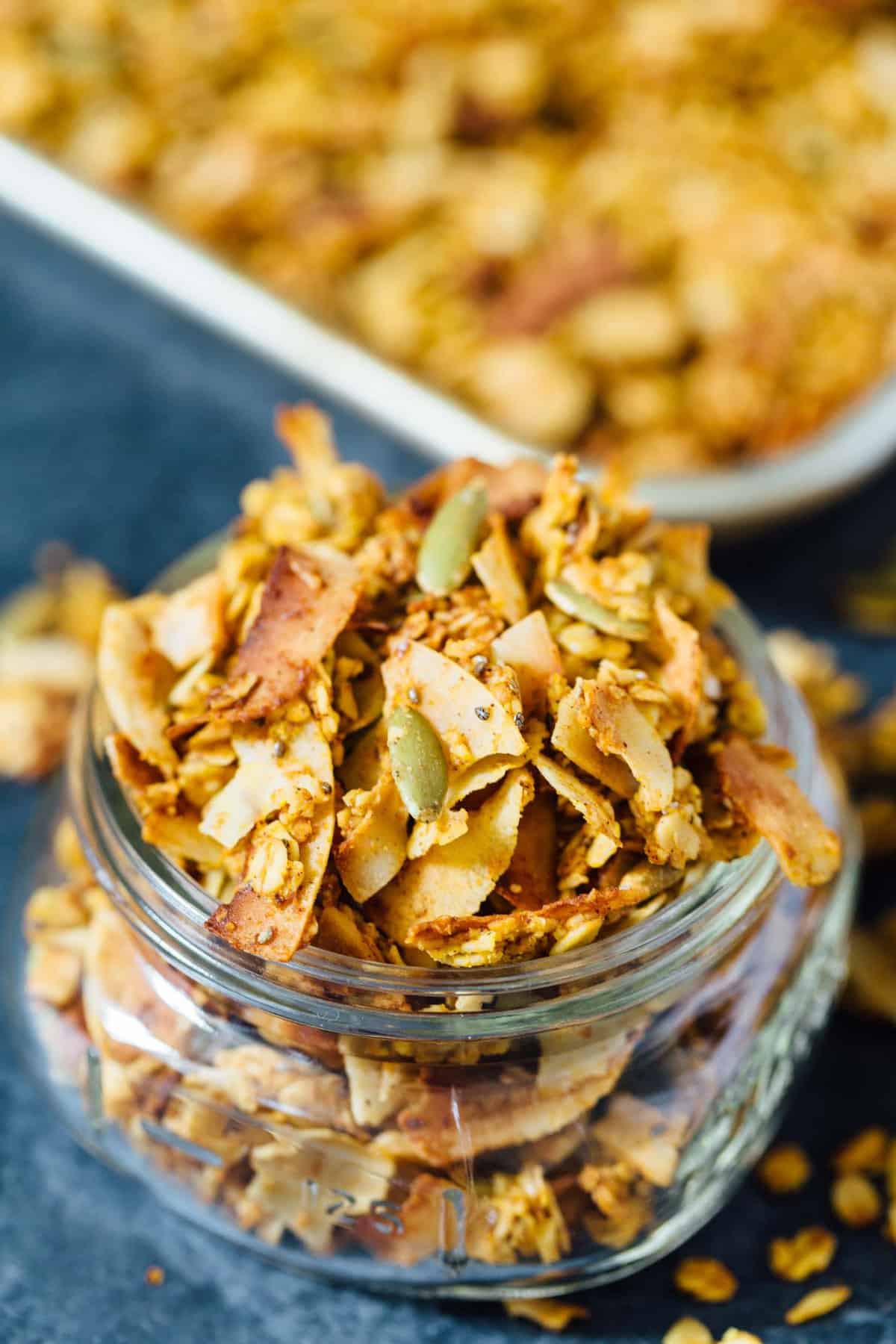 This pumpkin coconut granola has all the flavors of Fall in this sweet and salty combination! It's perfect to top on plain yogurt, oats, or even with milk!