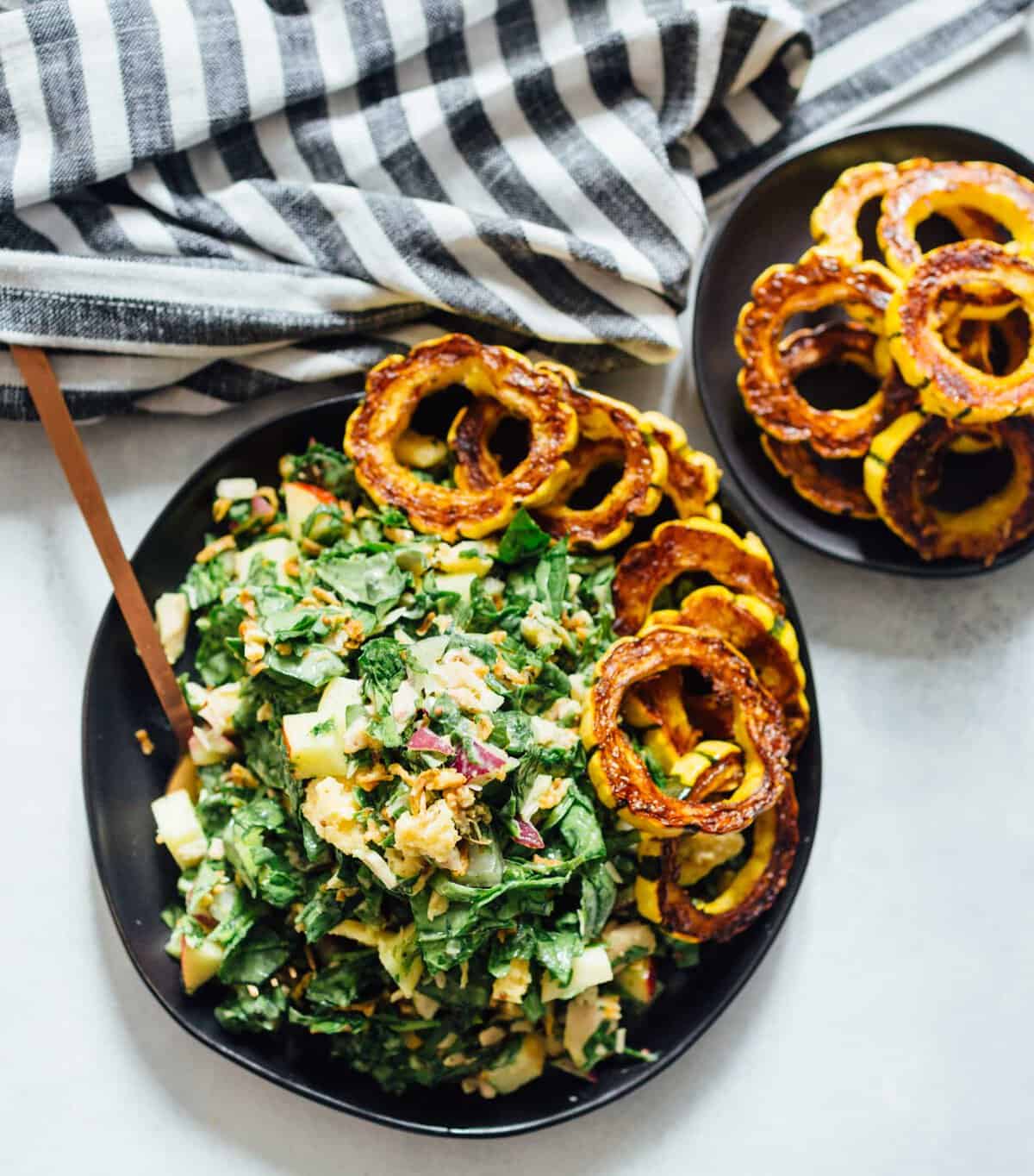 A spinach tuna salad topped with roasted delicata squash is a heavenly combination! The delicata squash gives it a unique yet distinct sweetness but it also adds volume to make this salad hearty and filling!