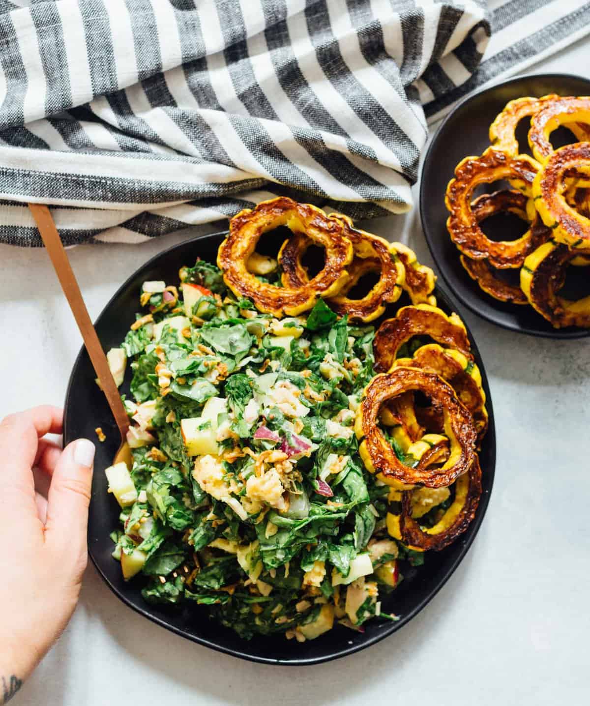 A spinach tuna salad topped with roasted delicata squash is a heavenly combination! The delicata squash gives it a unique yet distinct sweetness but it also adds volume to make this salad hearty and filling!