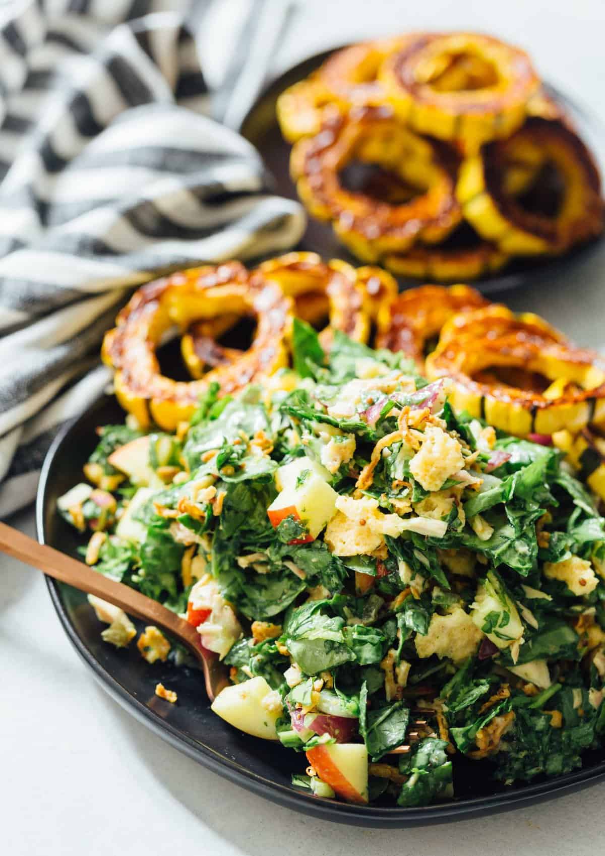 A spinach tuna salad topped with roasted delicata squash is a heavenly combination! The delicata squash gives it a unique yet distinct sweetness but it also adds volume to make this salad hearty and filling!