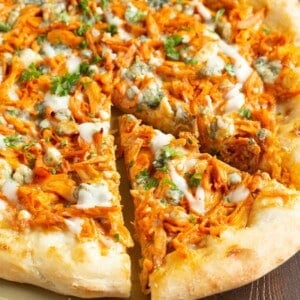 If you love buffalo chicken wings, then you will love this buffalo chicken pizza! The perfect alternative to have during game day if you don't want a bunch of messy hands around! #buffalochicken #pizza #buffalosauce #pizzarecipe