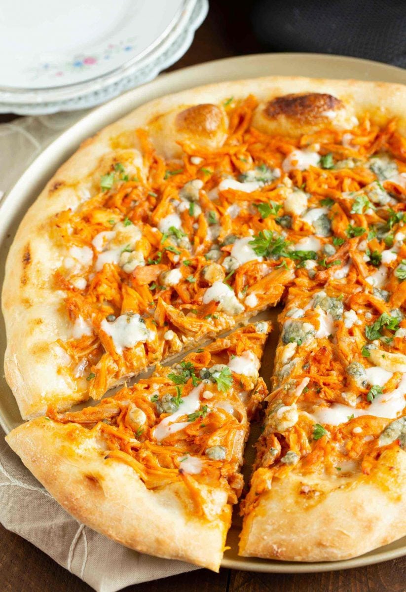 If you love buffalo chicken wings, then you will love this buffalo chicken pizza! The perfect alternative to have during game day if you don't want a bunch of messy hands around! #buffalochicken #pizza #buffalosauce #pizzarecipe