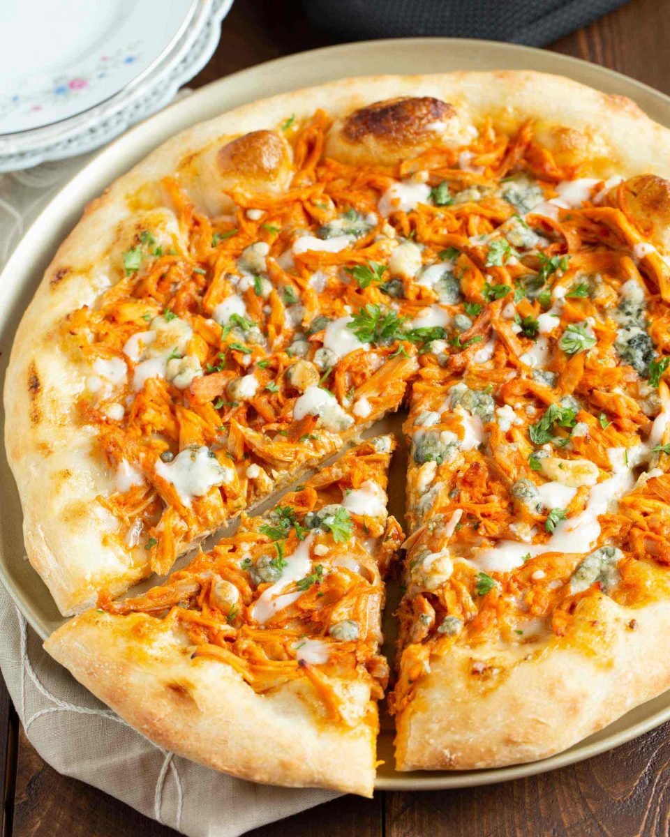 If you love buffalo chicken wings, then you will love this buffalo chicken pizza! The perfect alternative to have during game day if you don't want a bunch of messy hands around! #buffalochicken #pizza #buffalosauce #pizzarecipe
