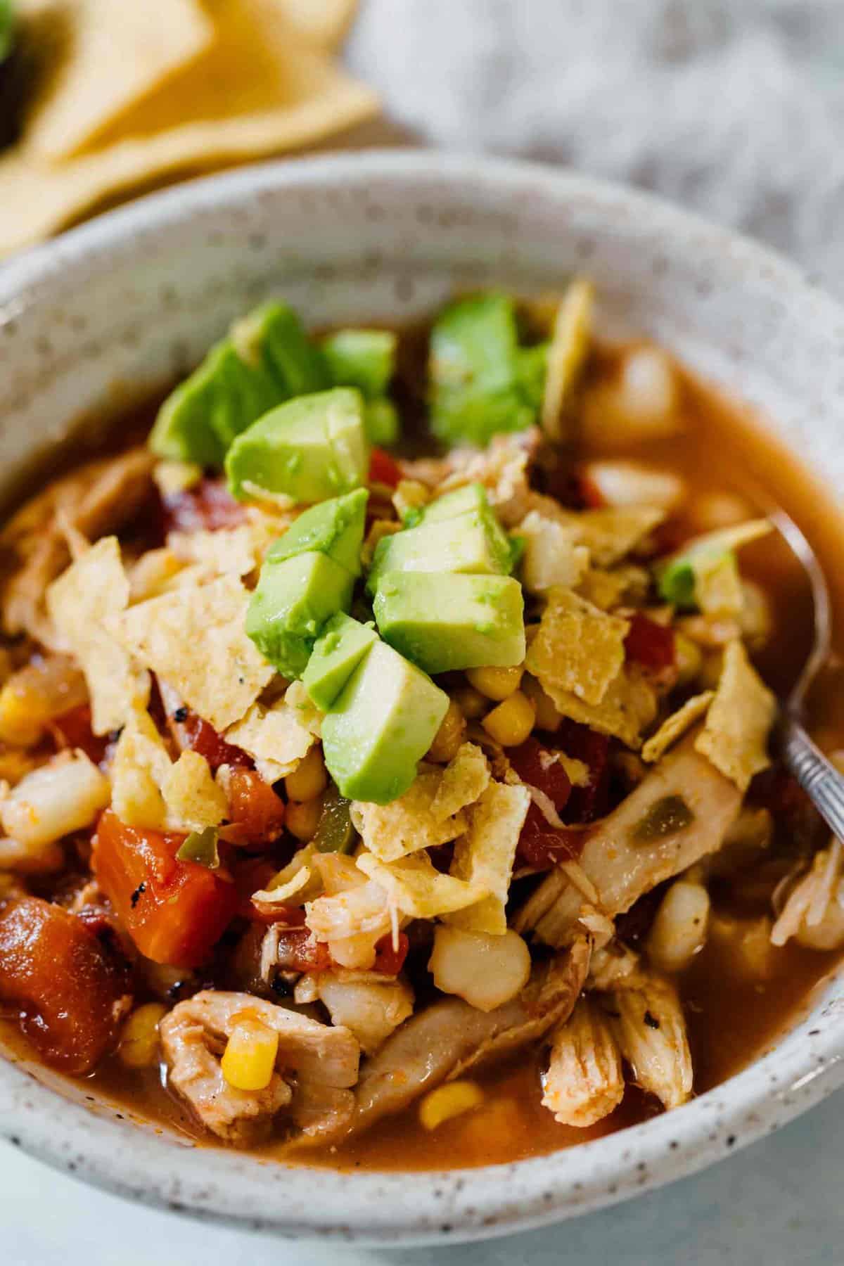This chicken tortilla soup made on the stovetop is deliciously flavorful and spicy! You'll love how quickly it comes together and all the textures throughout the soup! The broth is SO good you'll be going back for more bowls!