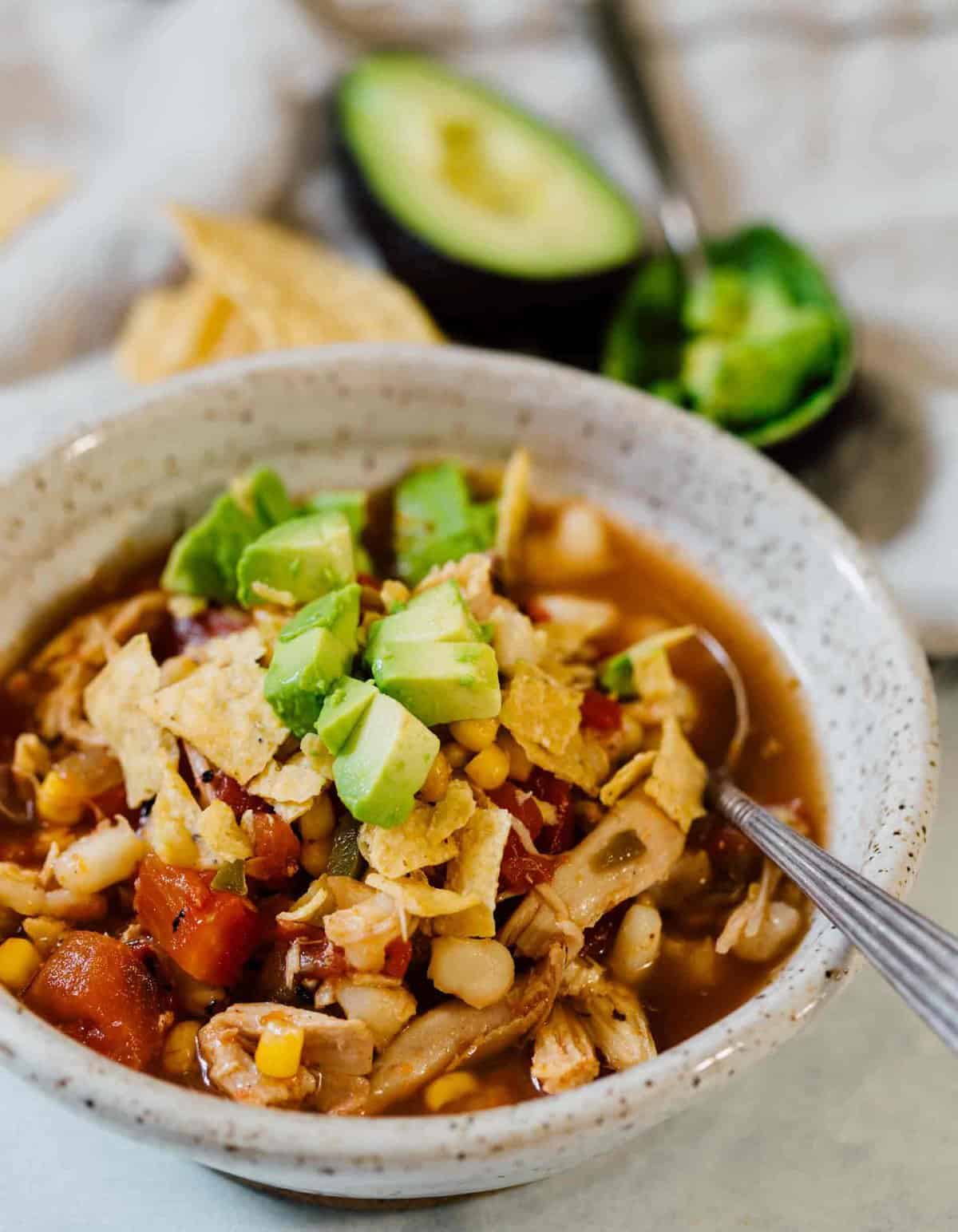 This chicken tortilla soup made on the stovetop is deliciously flavorful and spicy! You'll love how quickly it comes together and all the textures throughout the soup! The broth is SO good you'll be going back for more bowls!