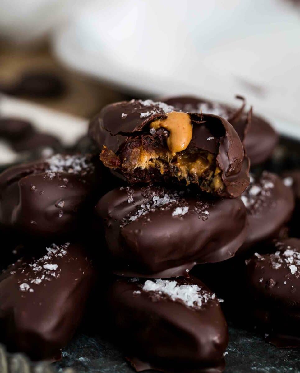 These chocolate covered stuffed dates are insanely easy to make and far too easy to eat just one. I dare you to resist having just one! These chocolate covered stuffed dates are insanely easy to make and far too easy to eat just one. I dare you to resist having just one!