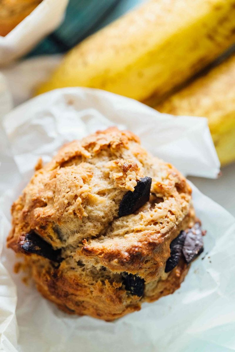 These peanut butter and chocolate banana muffins are so soft and tender with the biggest domed top! They're just like straight out of a bakery!