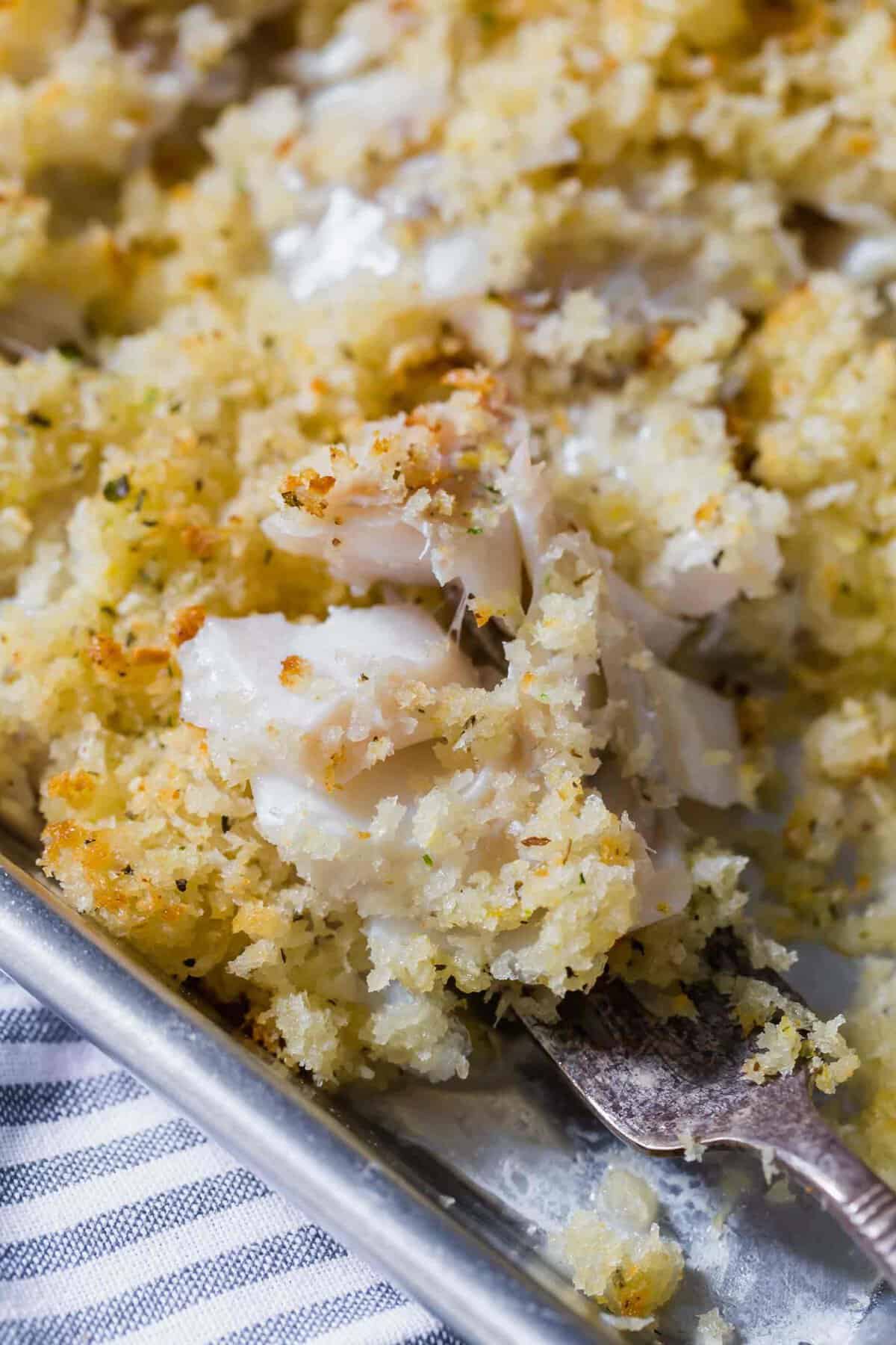 Closeup of flaky haddock on fork